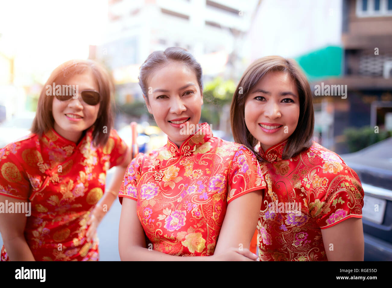 group of asian woman wearing chinese tradition clothes toothy smiling face happiness emotion Stock Photo