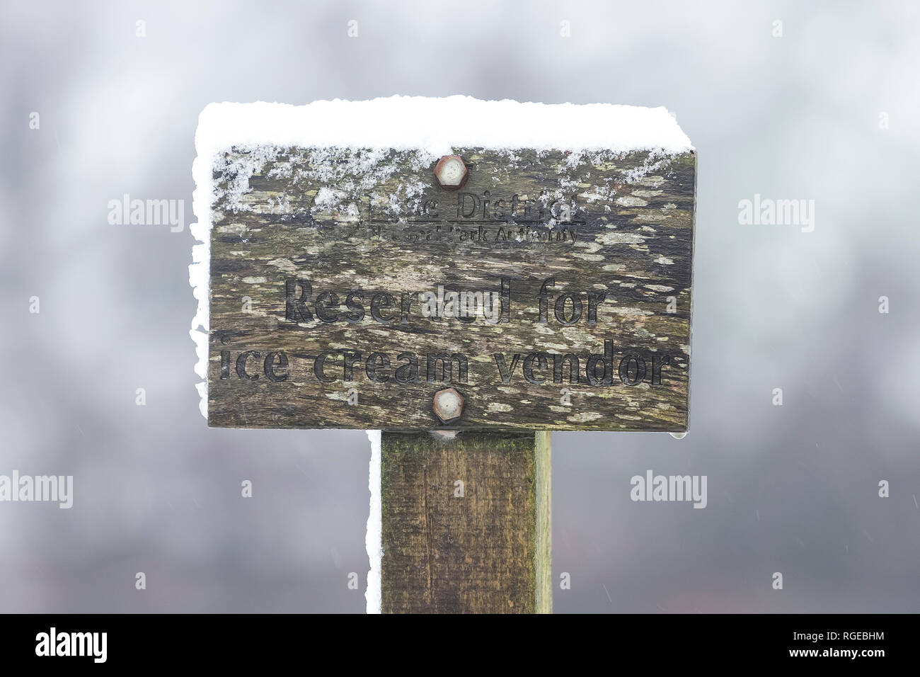 Thirlmere, Keswick, Cumbria. 29th Jan 2019. UK Weather: A sign labelled 'Reserved for Ice Cream Vendor', pictured in snowy conditions at Thirlmere, Keswick, Cumbria, UK. 29th January 2019. Photograph by Richard Holmes. Credit: Richard Holmes/Alamy Live News Stock Photo