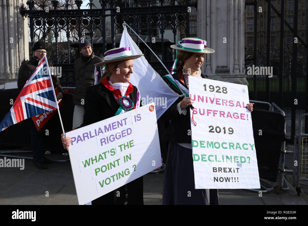 London, UK. 29th January 2019. Two Leave protesters campaigning with boards referring to universal suffrage, Parliament Square , London, UK. Credit: Joe Kuis /Alamy Live News Stock Photo