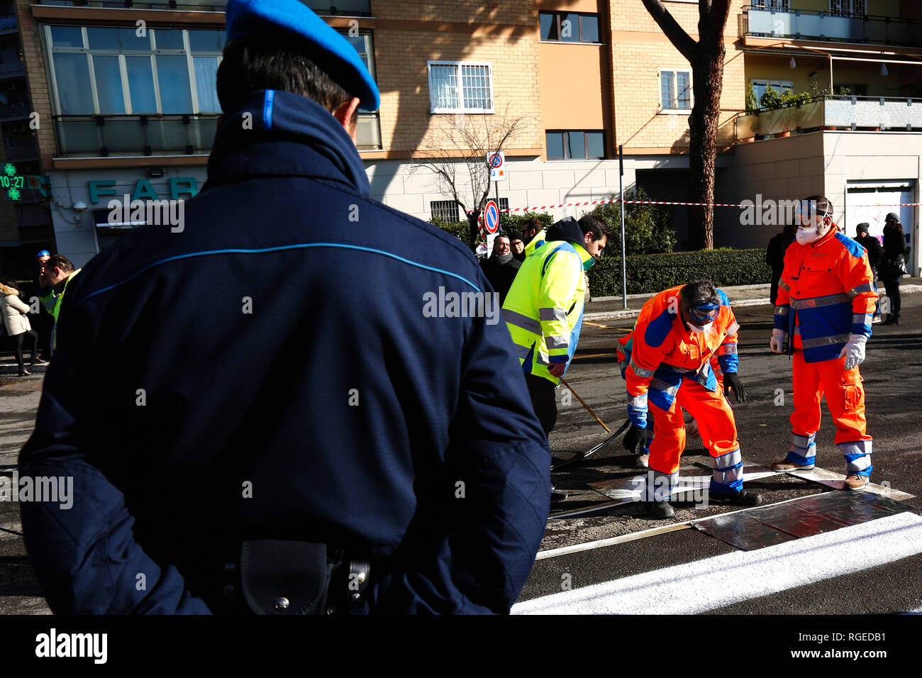 Rome January 29th 2019. Detainees from Rome jail Rebibbia working for the rebuilding of the road surface, cleaning of manholes and painting of the horizontal signs, within a program of rehabilitation. Foto Samantha Zucchi Insidefoto Stock Photo