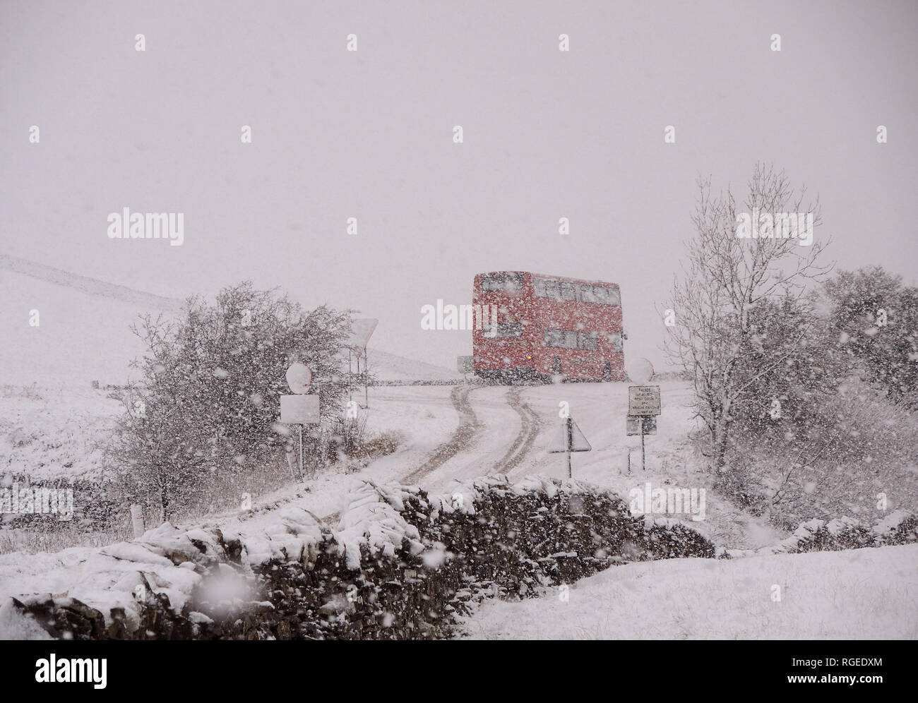 Kirkby Stephen, Cumbria, Wales. 28th Jan 2019. UK Weather: A double decker from Cumbria Classic Coaches struggles through a snowstorm along the A685 into Kirkby Stephen, Cumbria, which saw a good 4 inches of snow fall in a short space of time, making driving conditions treacherous. Credit: Wayne HUTCHINSON/Alamy Live News Stock Photo