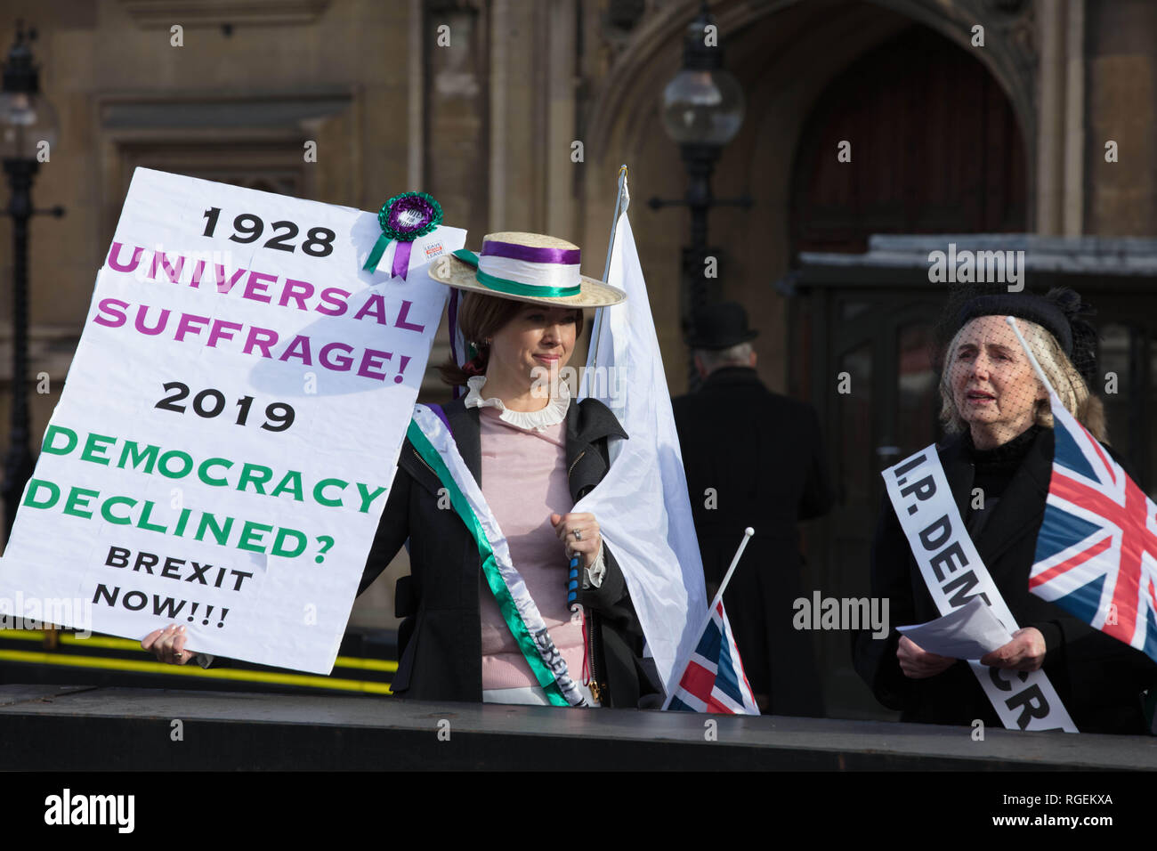 London, UK. 29th January, 2019. Two women dressed up as Suffragettes, reminding us about the fight for democracy, which, they claim, is now denied. Place: in front of Parliament, London, UK. Credit: Joe Kuis / Alamy Live News Stock Photo