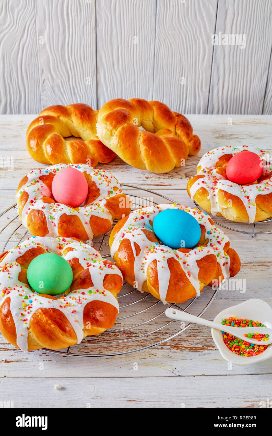 individual sweet Italian braided Easter Bread Rings glazed around dyed