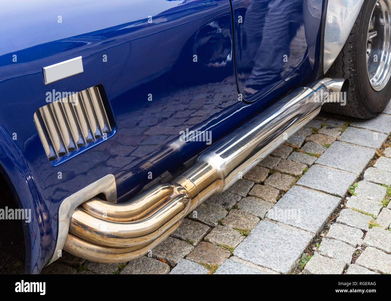 Exhaust system of an American sports car of the sixties Stock Photo