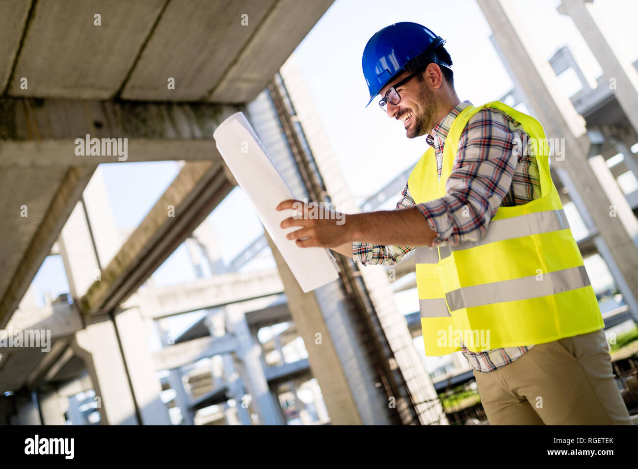 Picture of construction site engineer looking at plan Stock Photo Alamy
