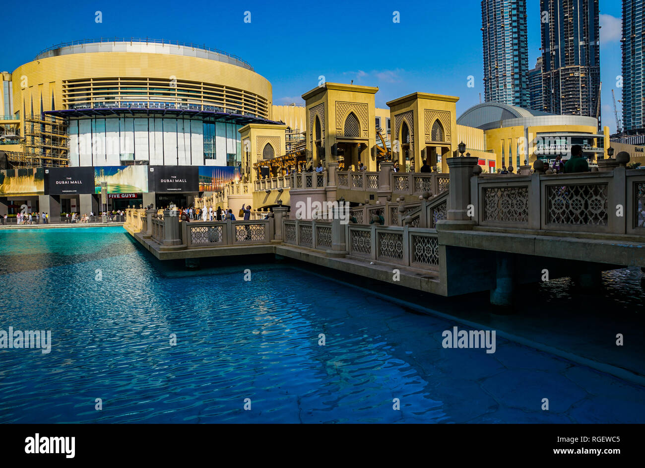 One warm winter day in Dubai city; the Dubai mall, the Khalifa tower, Dubai fountains. Showing architecture of buildings and hotels and skyscrapers Stock Photo