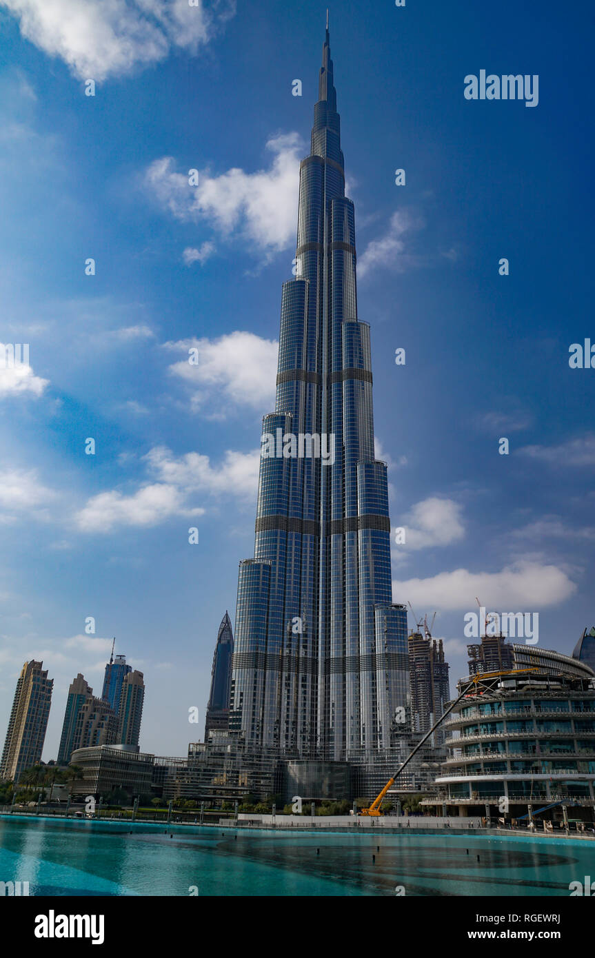 One warm winter day in Dubai city; the Dubai mall, the Khalifa tower, Dubai fountains. Showing architecture of buildings and hotels and skyscrapers Stock Photo
