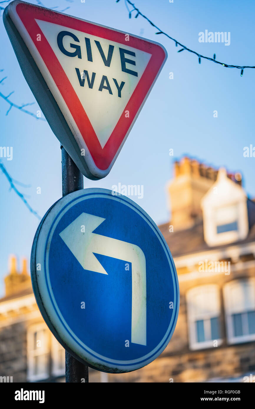 Give Way and Turn left Stock Photo