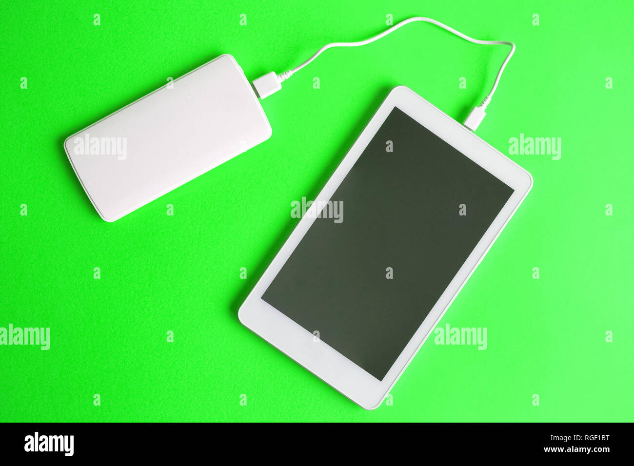 Download Flat Lay Of Blank Screen Digital Tablet Device Charging With Power Bank On Green Background Minimal Creative Concept Space For Copy Stock Photo Alamy PSD Mockup Templates