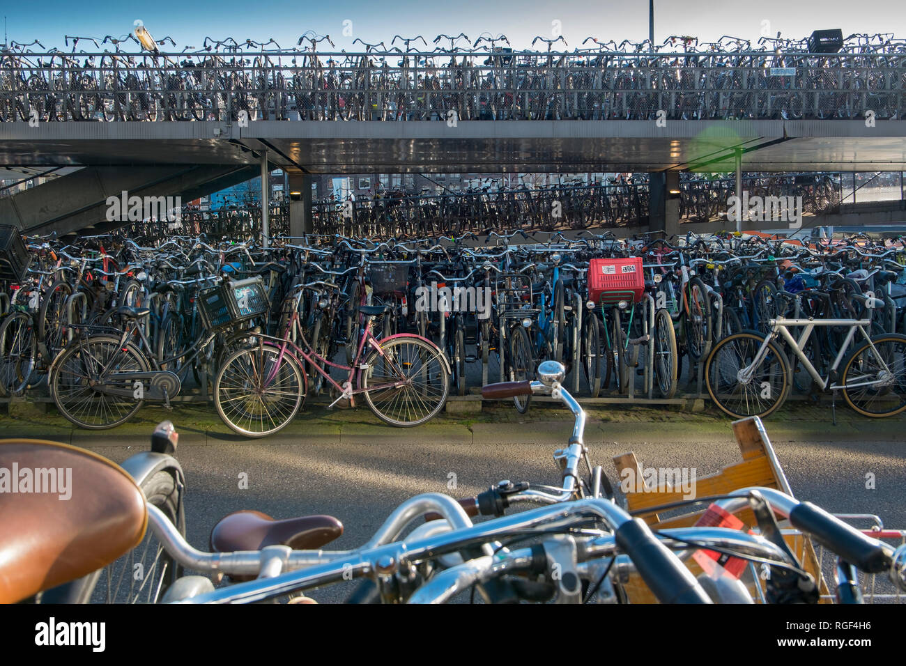 Hundreds of bicycles parked in a special parking garage for bikes near