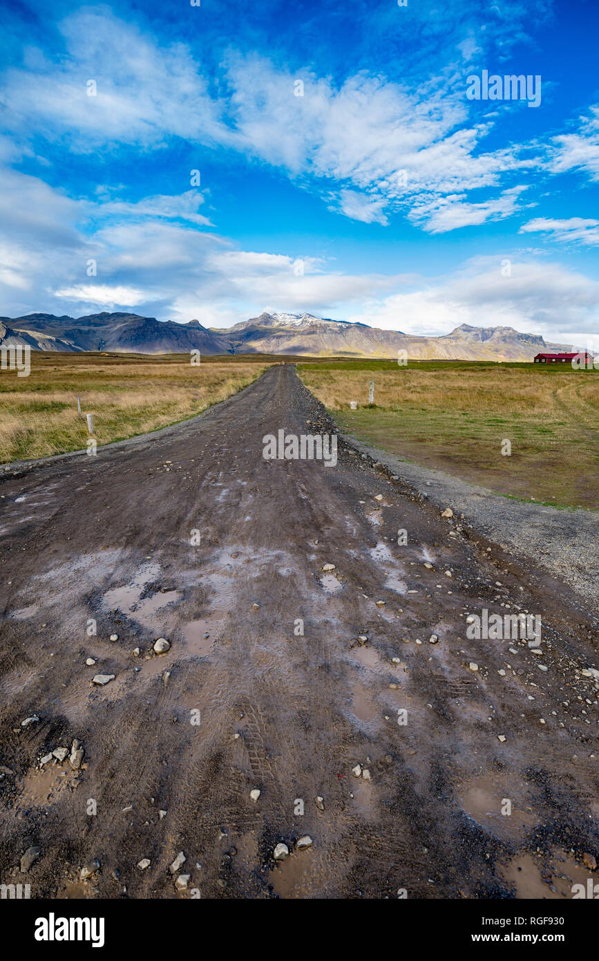 Endless Dirt road and blue sky in Iceland Stock Photo