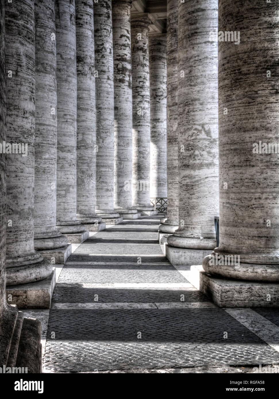 Vatican City, Rome. Part of the colonnade surrounding the Basilica of St. Peter. Stock Photo