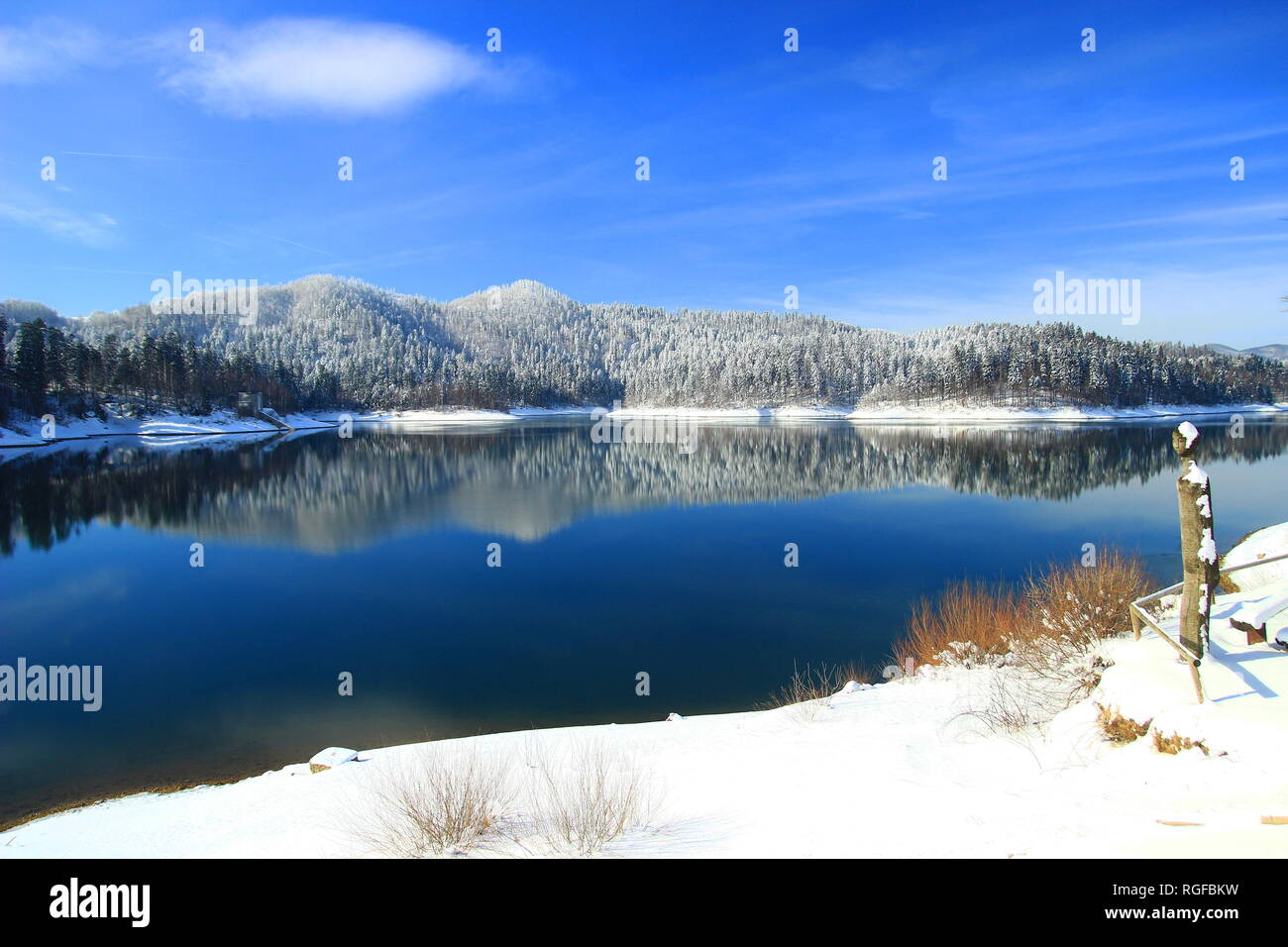 Winter landscape; Blue lake covered with snow, Gorski katar, Croatia Stock Photo