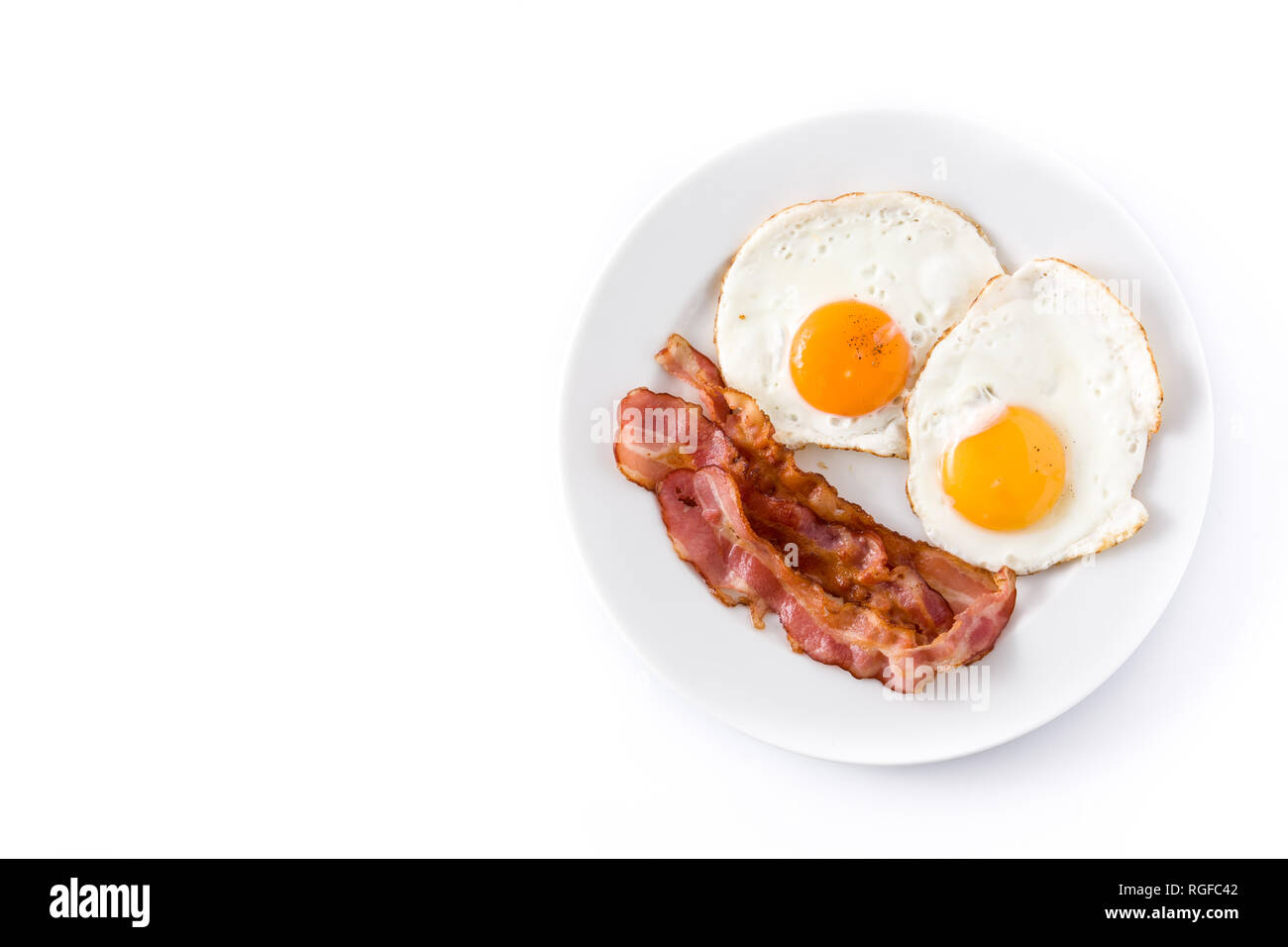 Fried eggs and bacon for breakfast isolated on white background.Top ...