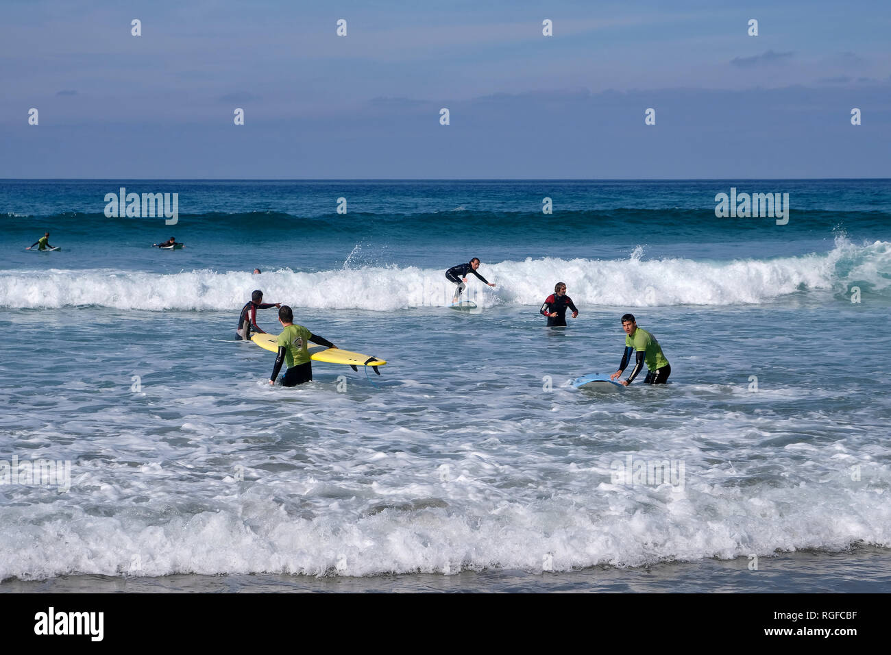 Surfer at Playa de Famara. Stock Photo
