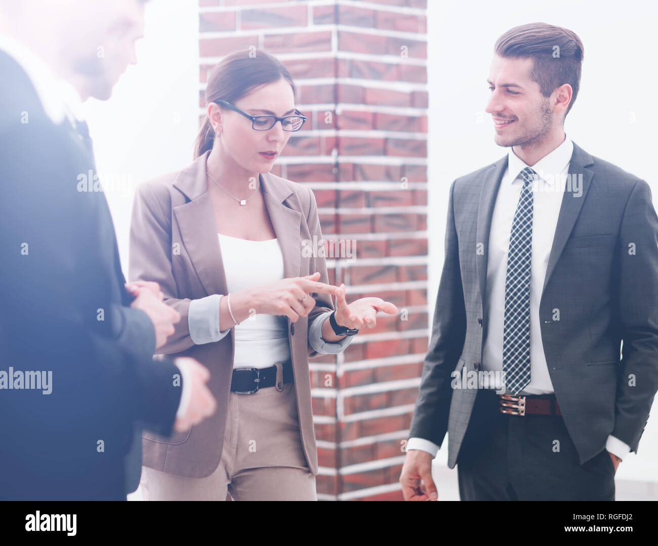 business team standing in the office hallway Stock Photo - Alamy