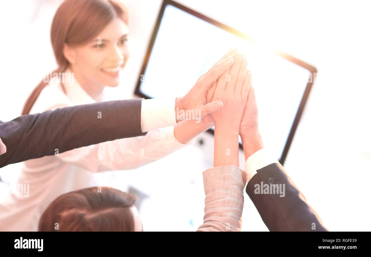successful business team giving each other a high five Stock Photo - Alamy