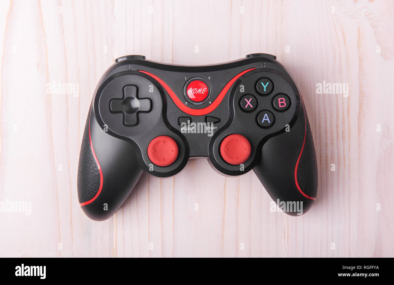 remote control for playing on a light wooden background Stock Photo Alamy