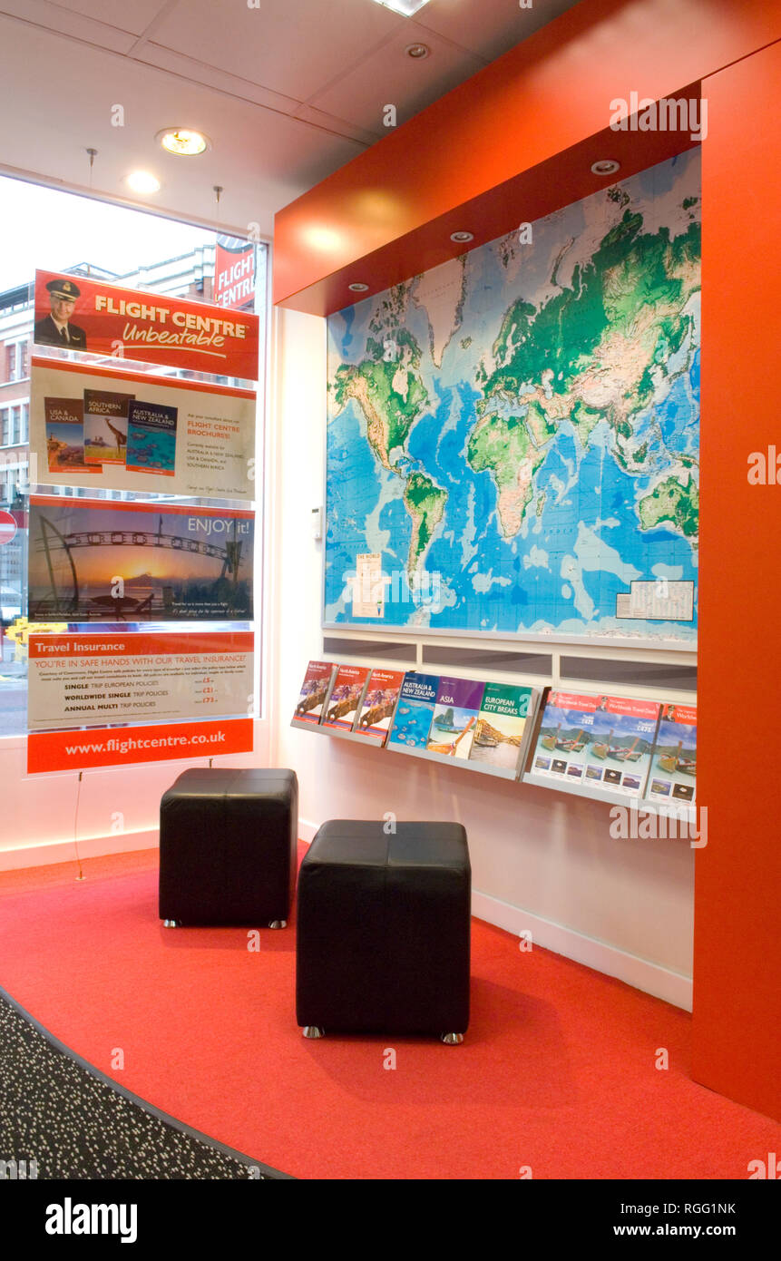 Flight Centre, Goodge Street, London, with world map poster Stock Photo