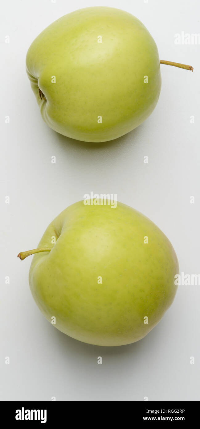Two green apples on white Stock Photo
