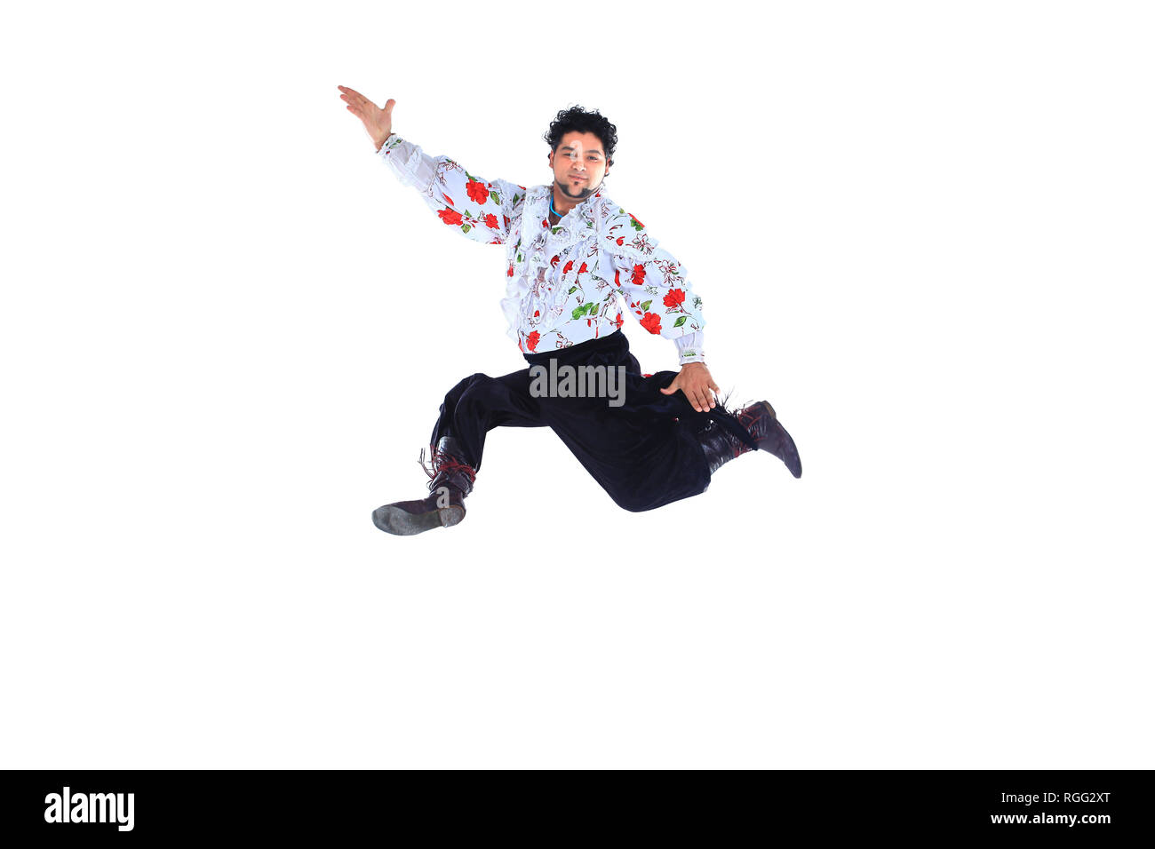 Gypsy male dancer in traditional dress performs folk dance Stock Photo