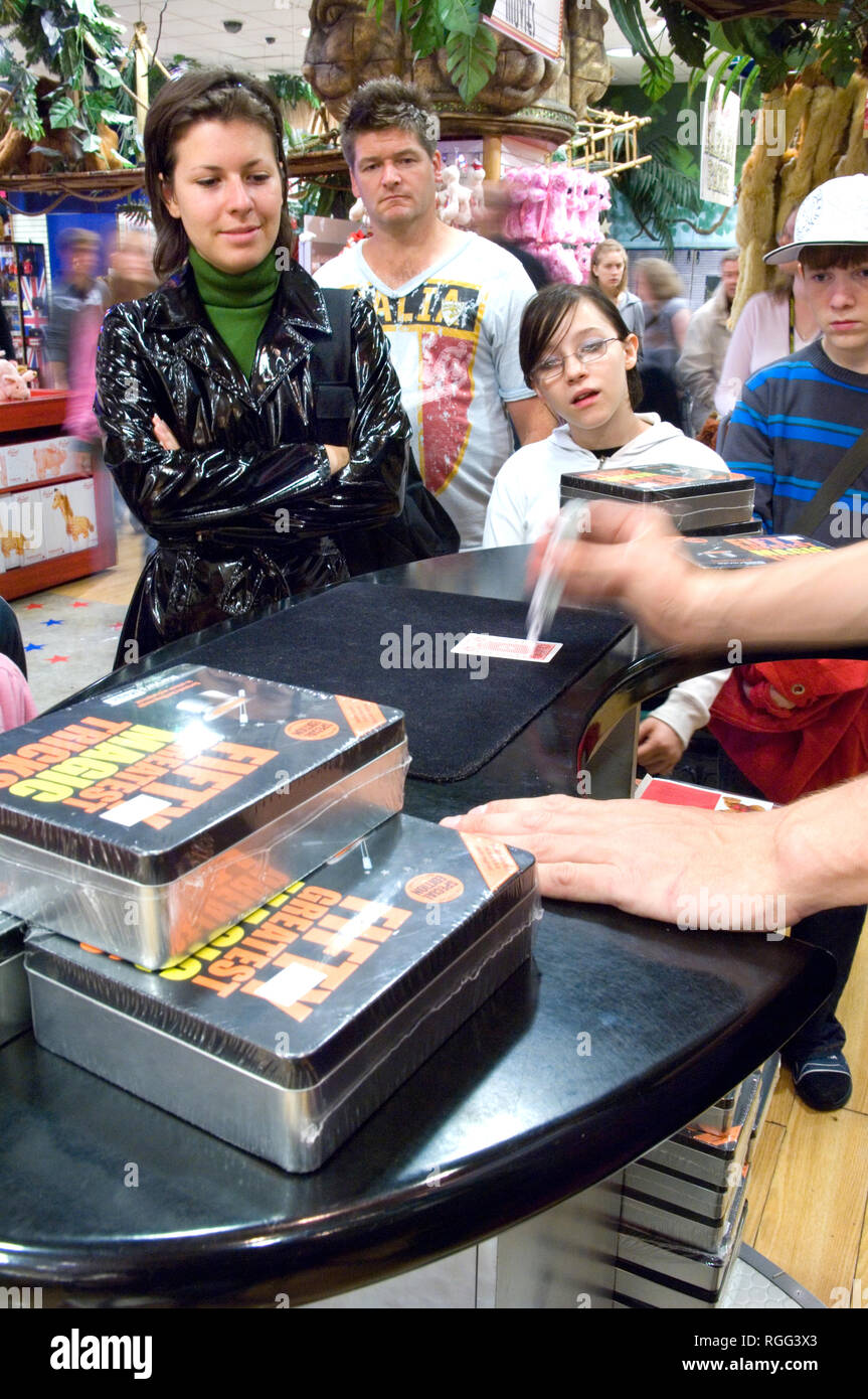 Demonstrating a magic trick at Marvins Magic in Hamleys Stock Photo - Alamy