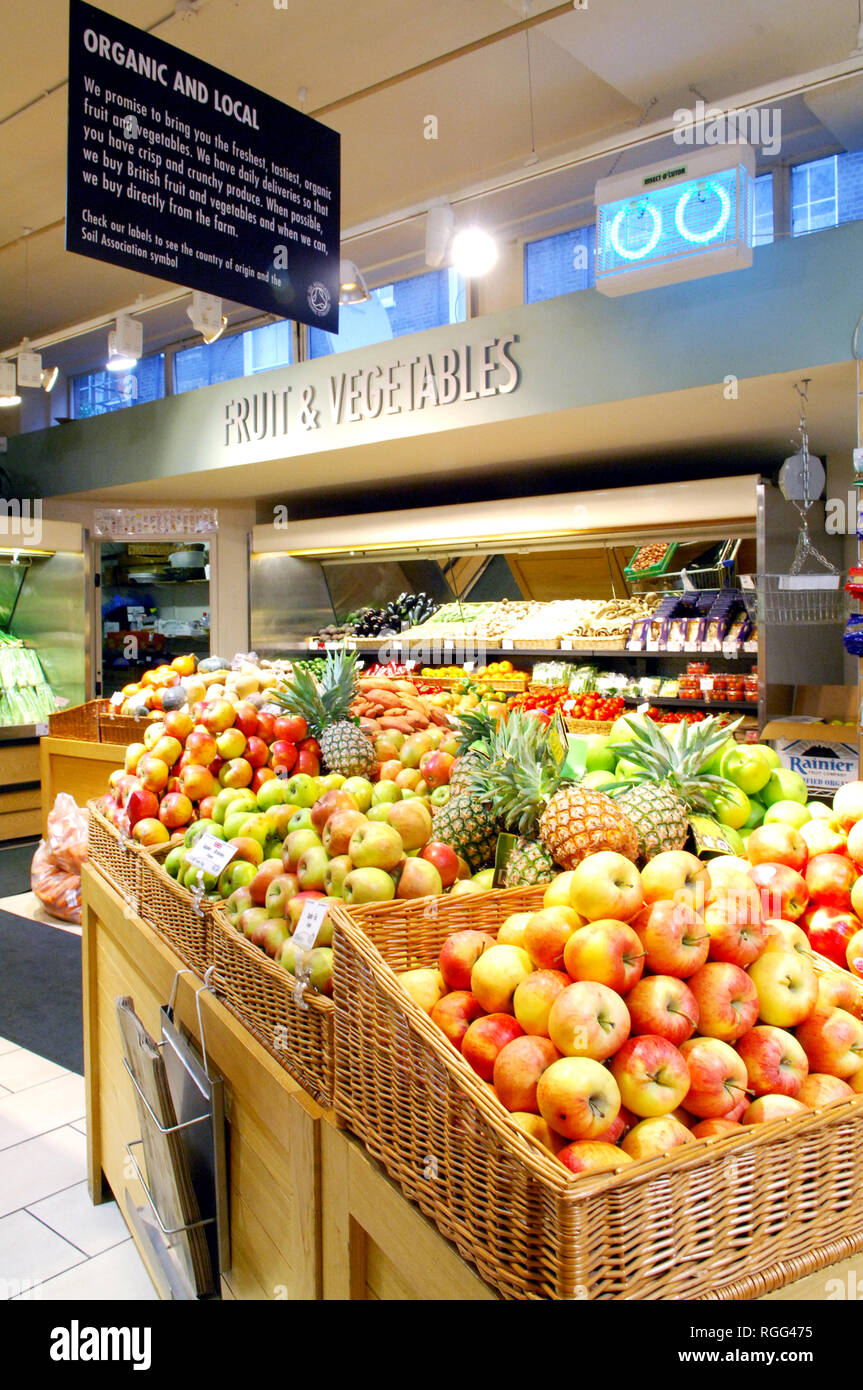 Organic and local fruit for sale in Planet Organic Westbourne Grove, London. Organic grocer. Stock Photo