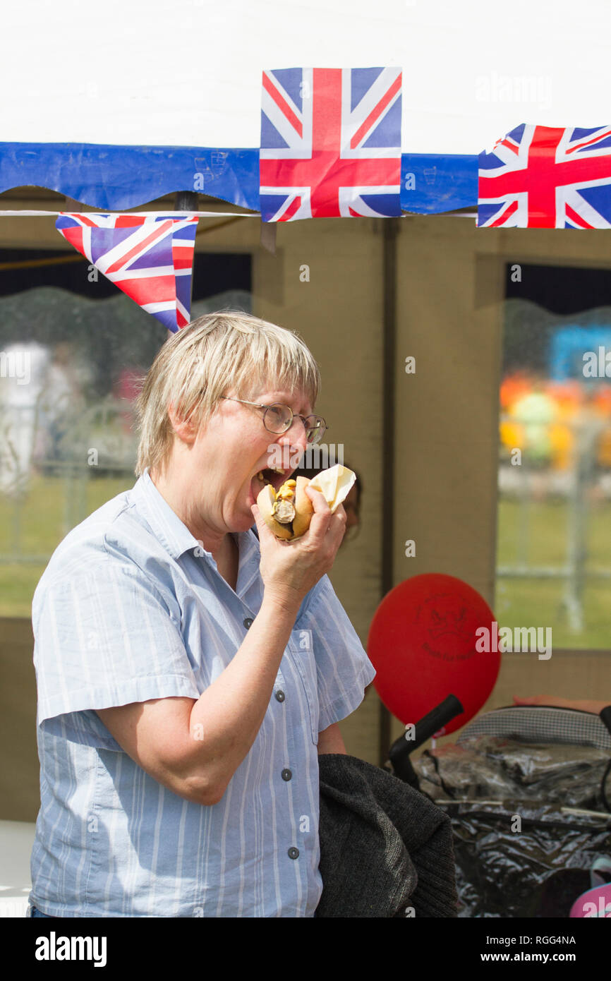 Person eating food outside - food shortages due to Brexit / leaving EU Stock Photo