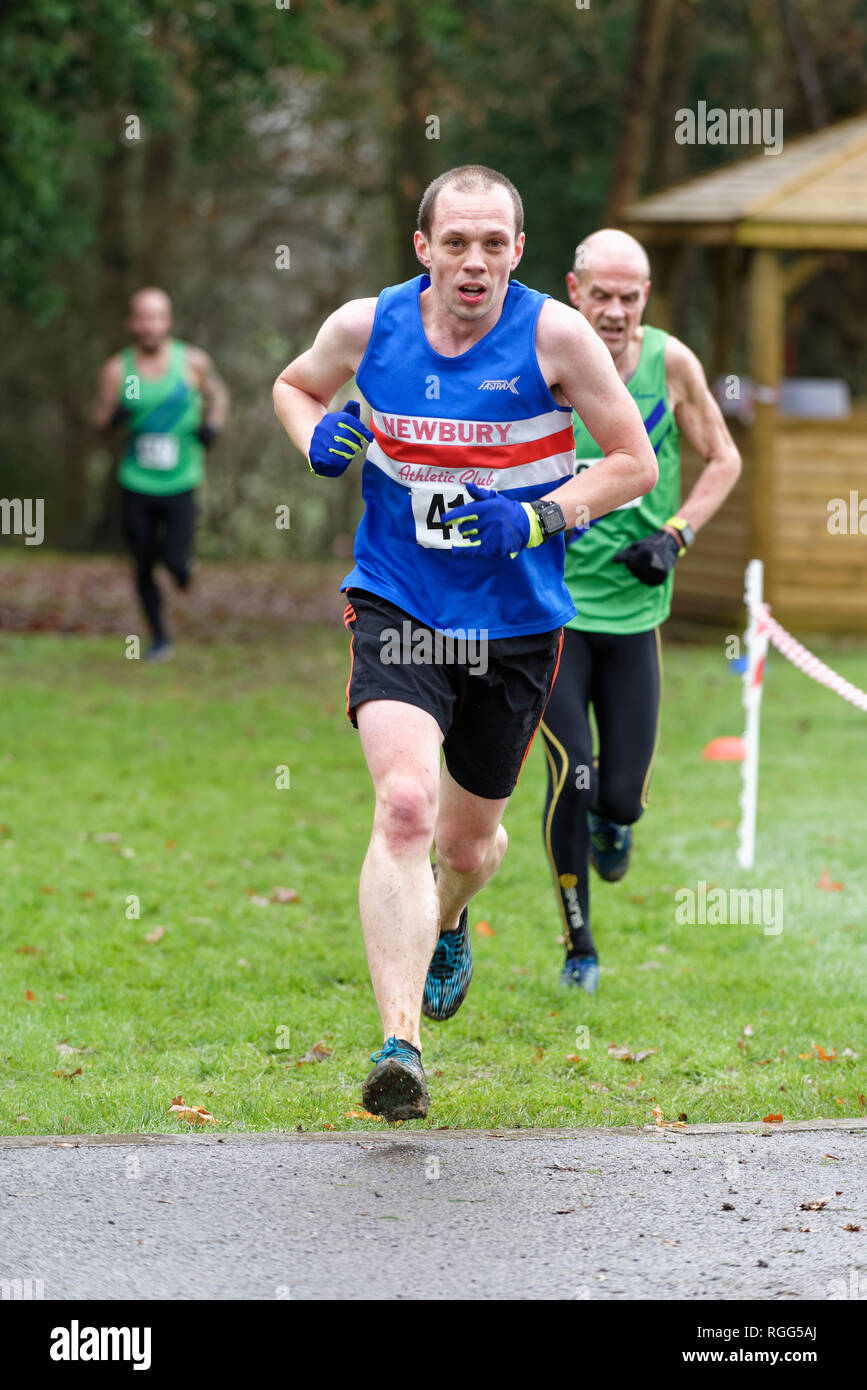 Male athletes compete at a Cross Country Race near Upper Basildon, Reading Berkshire Stock Photo