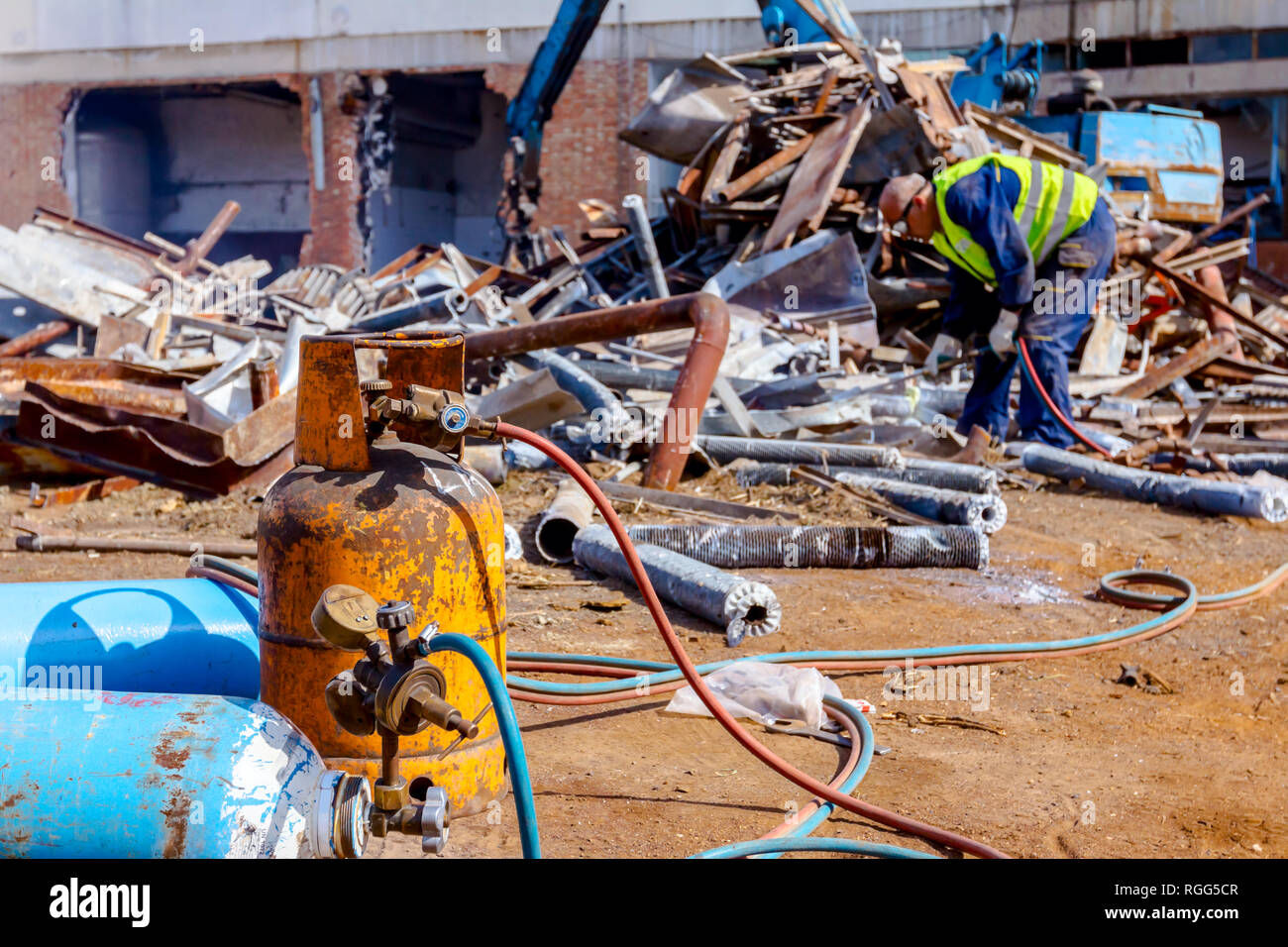 Oxygen and butane gas are in cylinder tanks with attached gauge