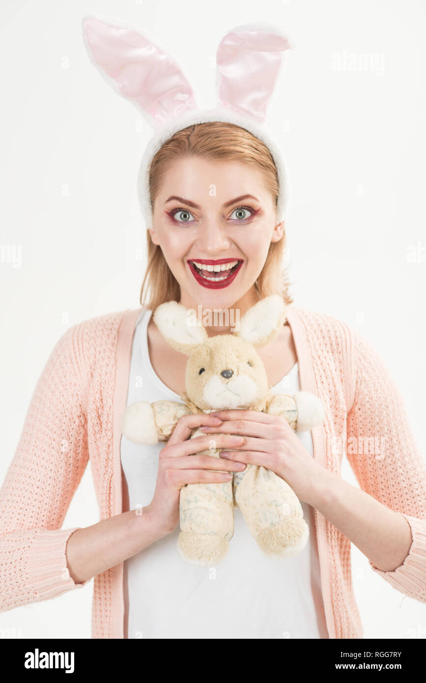 Egg hunt. Easter eggs as traditional food. Woman in rabbit bunny ears