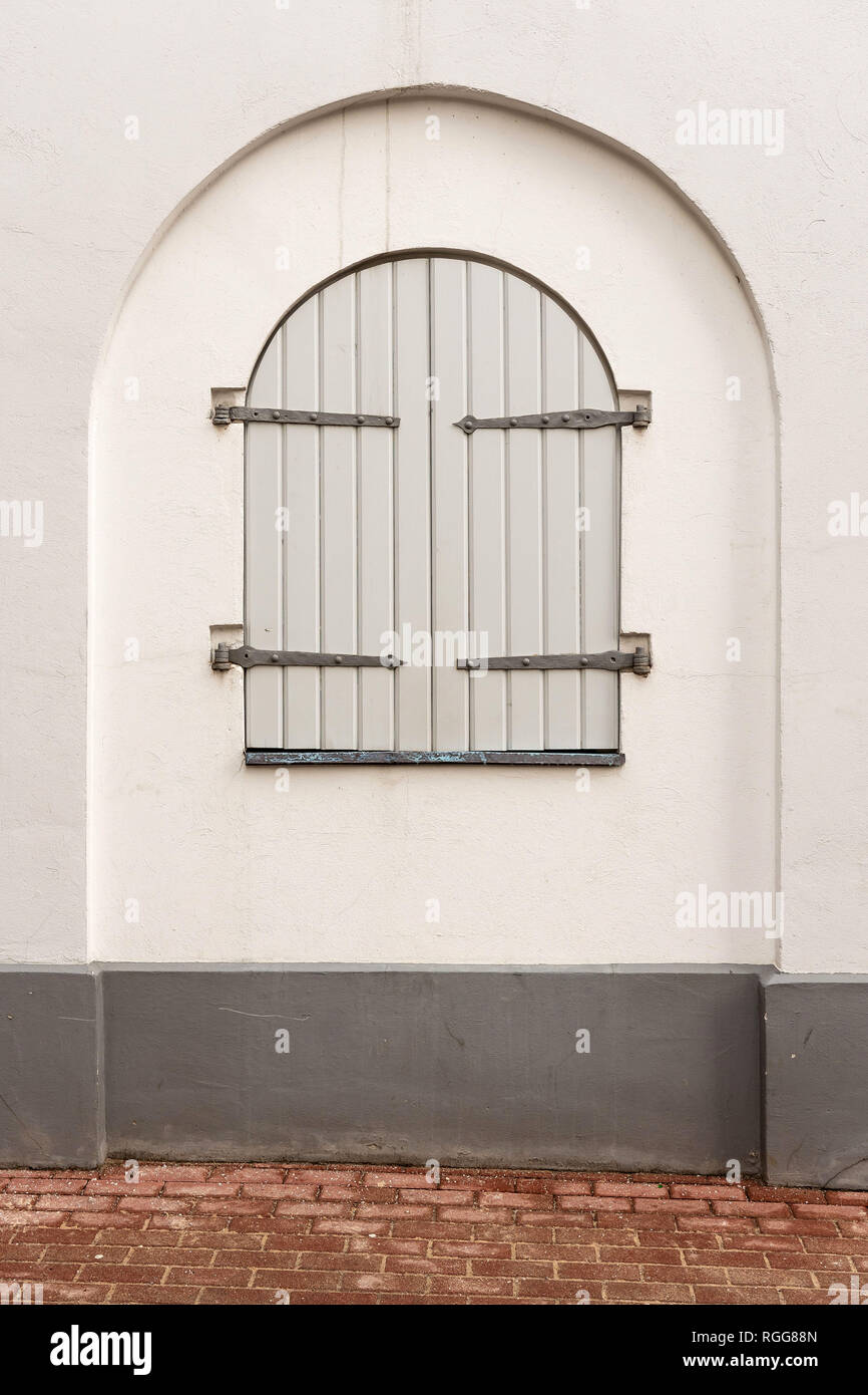 Window with shutters in the wall of an old building Stock Photo - Alamy