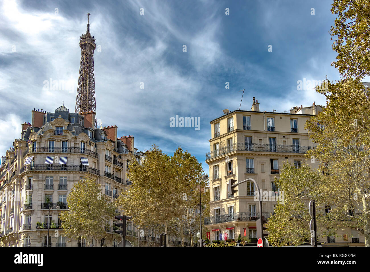The Eiffel Tower rises above elegant Parisian apartment buildings with