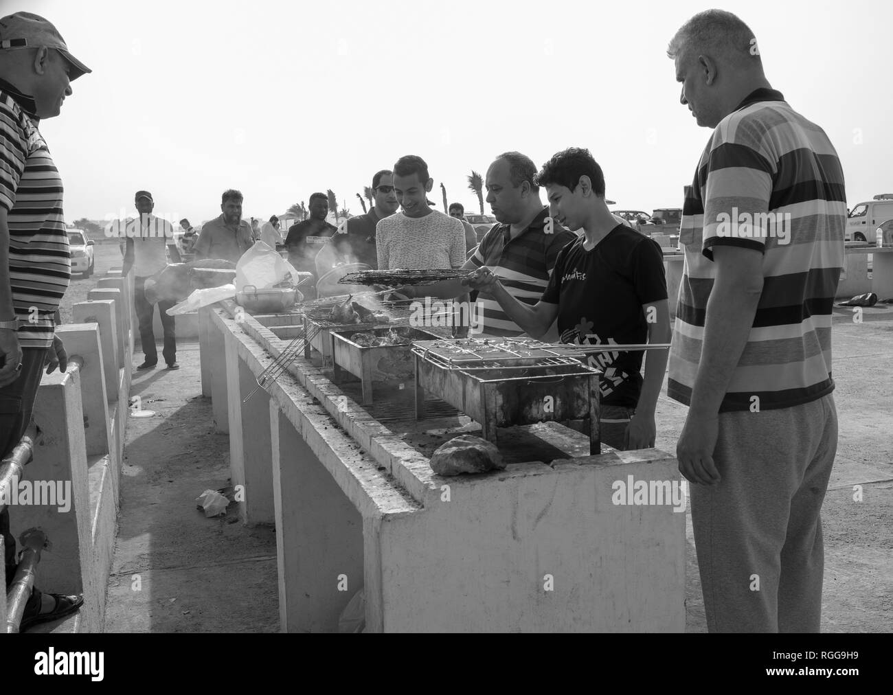 Group of arabic men cooking (BBQ) outdoor Stock Photo