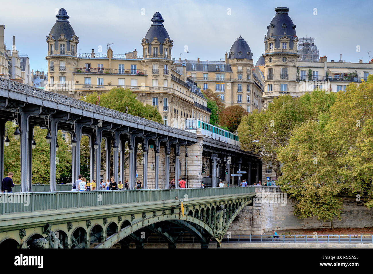 Having just departed Passy station, a Paris Metro Line 6 Metro train crosses Pont de Bir-Hakeim , a two tier viaduct bridge in Paris,France Stock Photo