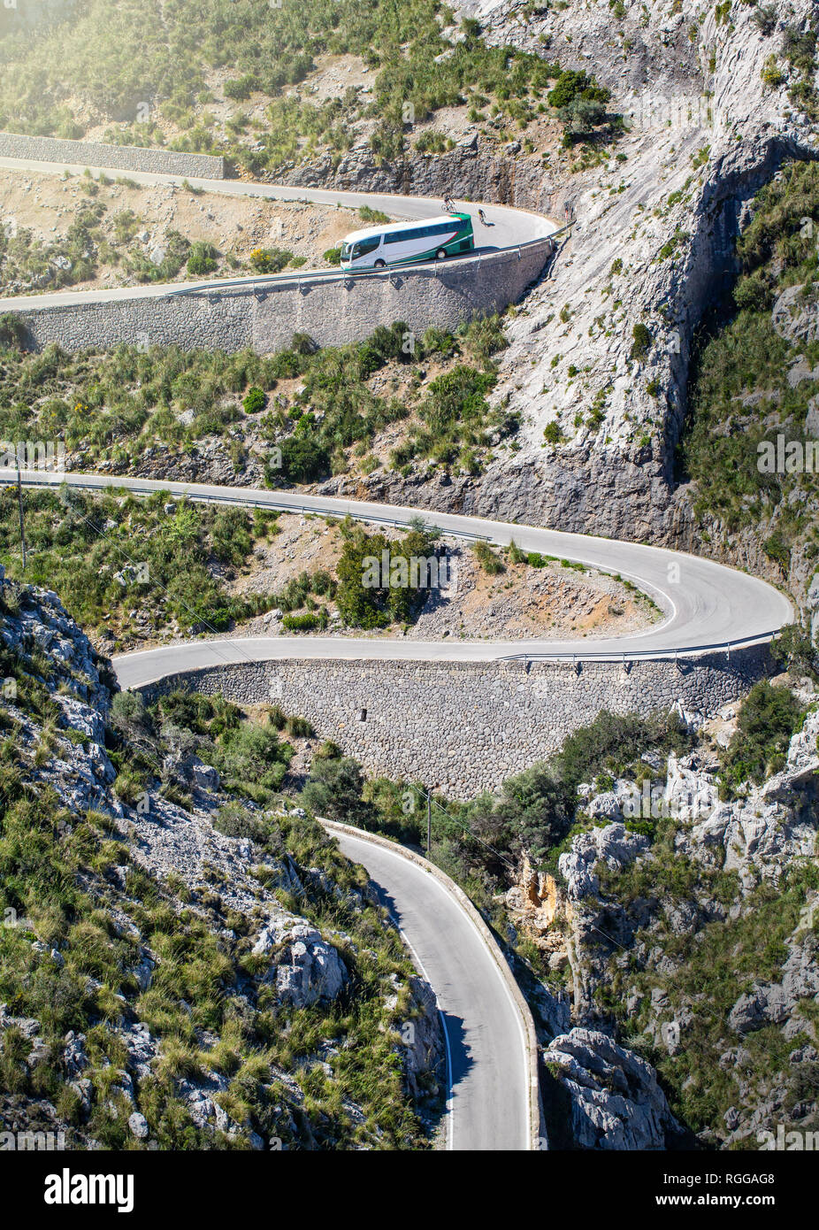 Cars driving popular among tourists beautiful winding mountain serpentine Coll dels Reis, Mallorca, Spain Stock Photo