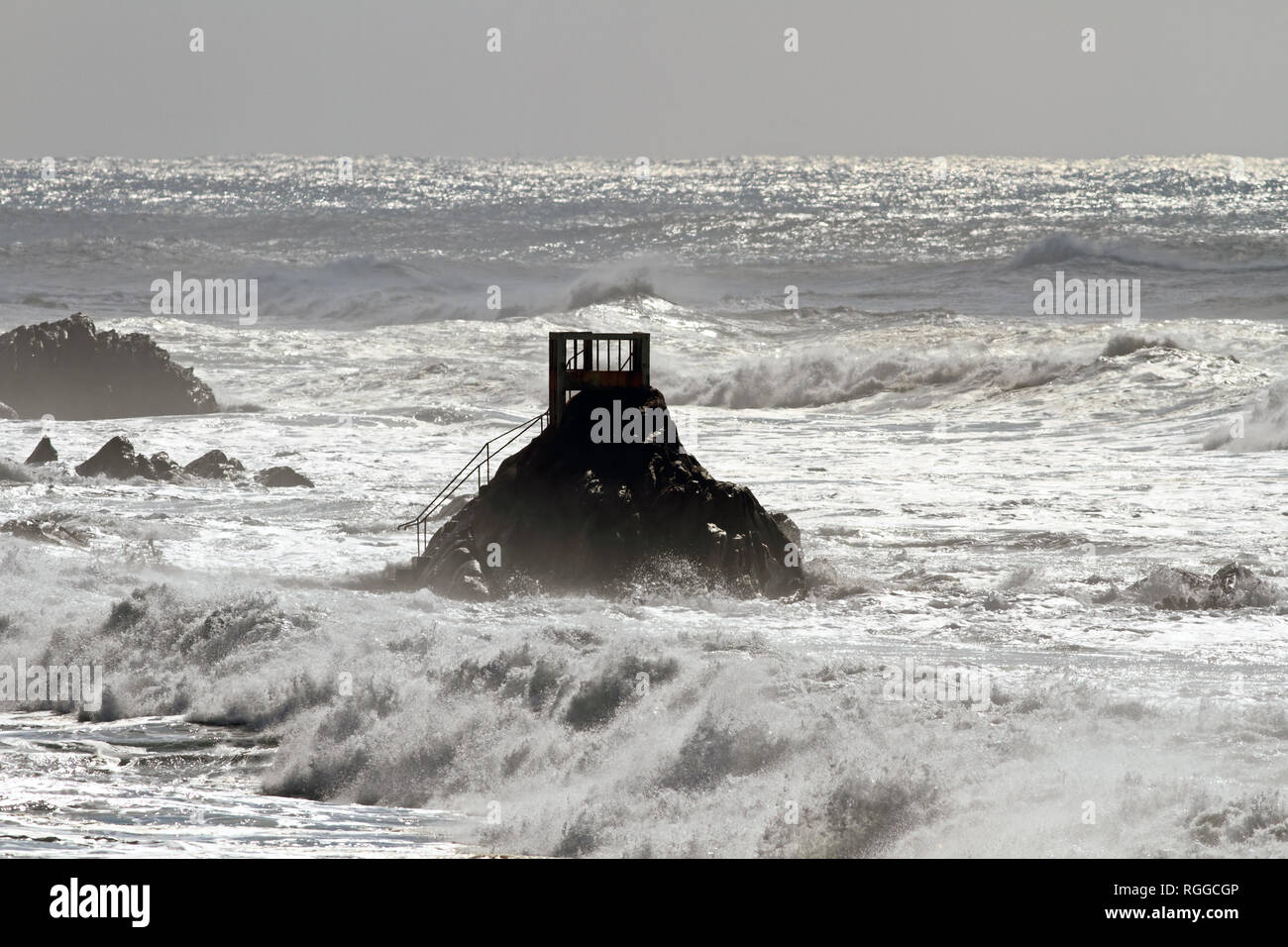 Beach of Vila do Conde, north of Portugal,  in the end of winter seeing belvedere and rough sea with sparkles Stock Photo