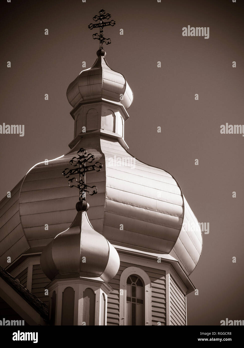 Onion Domes of the Church at the Ukrainian Folk Museum: Two domes topped by eastern crosses decorate the roof of the heritage church. Stock Photo