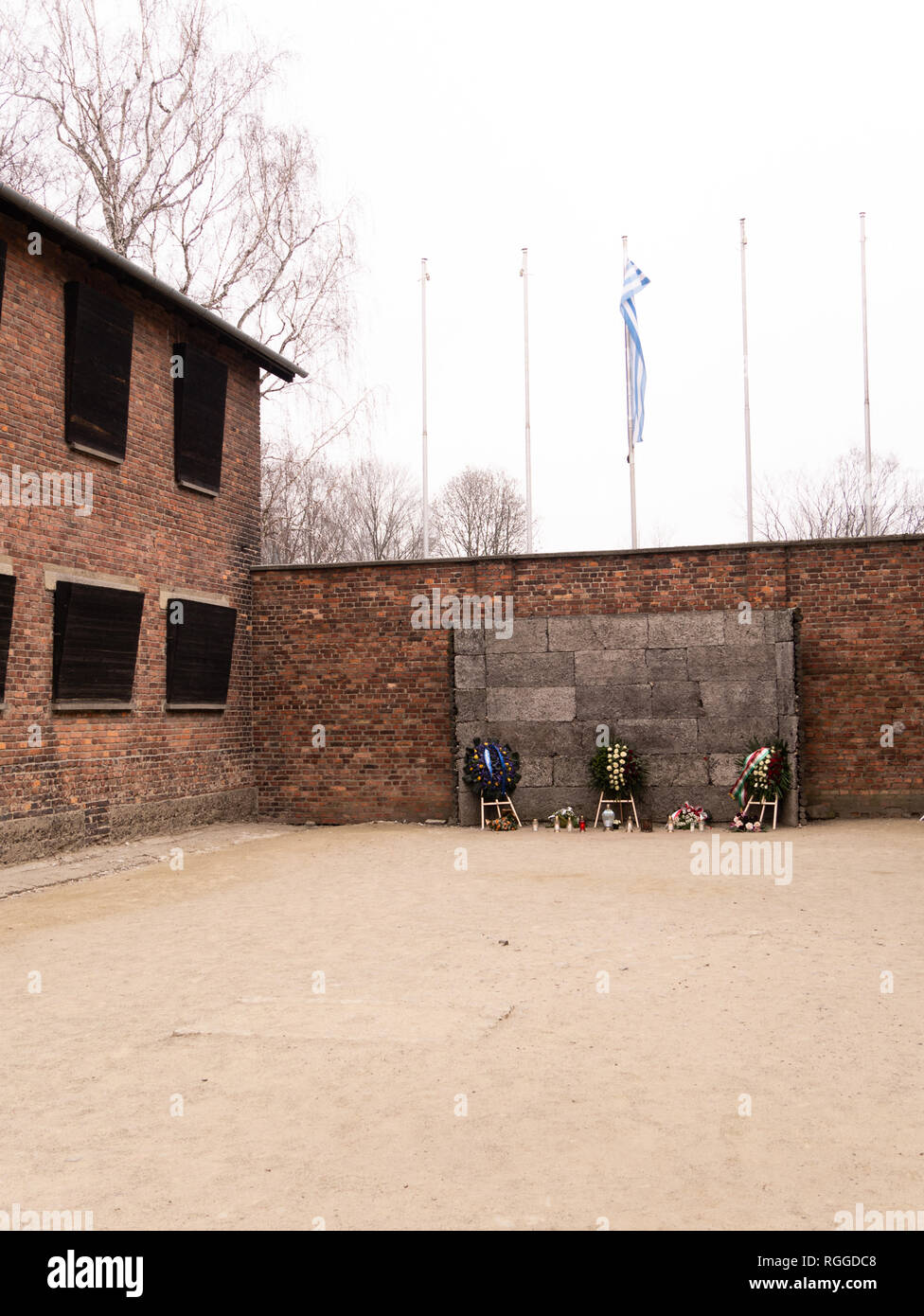 Boarded up windows of block 10 overlooking the death wall (execution wall), Auschwitz concentration and extermination camp, Oswiecim, Poland Stock Photo