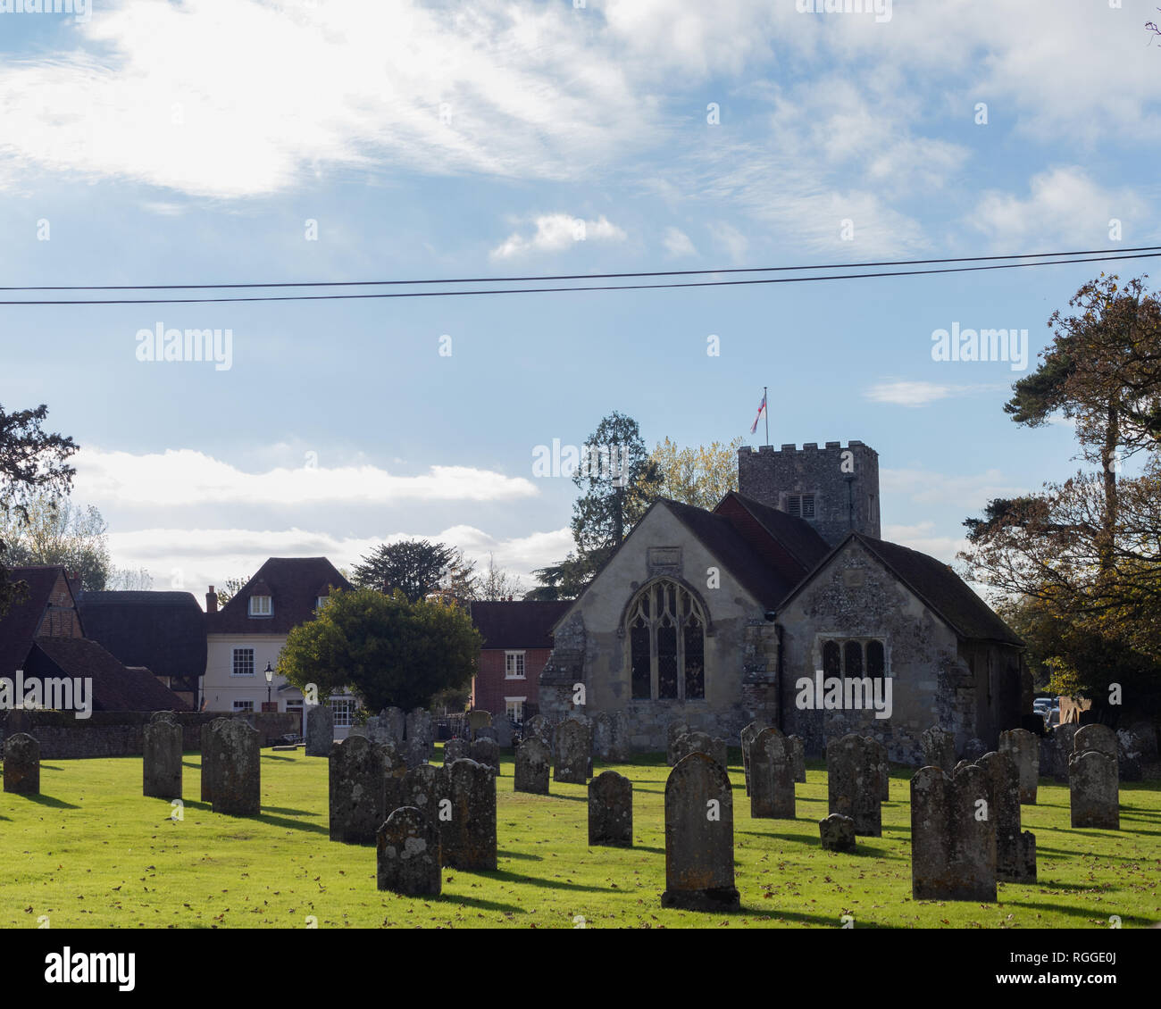 the graveyard at st James church southwick with grave yard in the foreground, a typical old English church Stock Photo