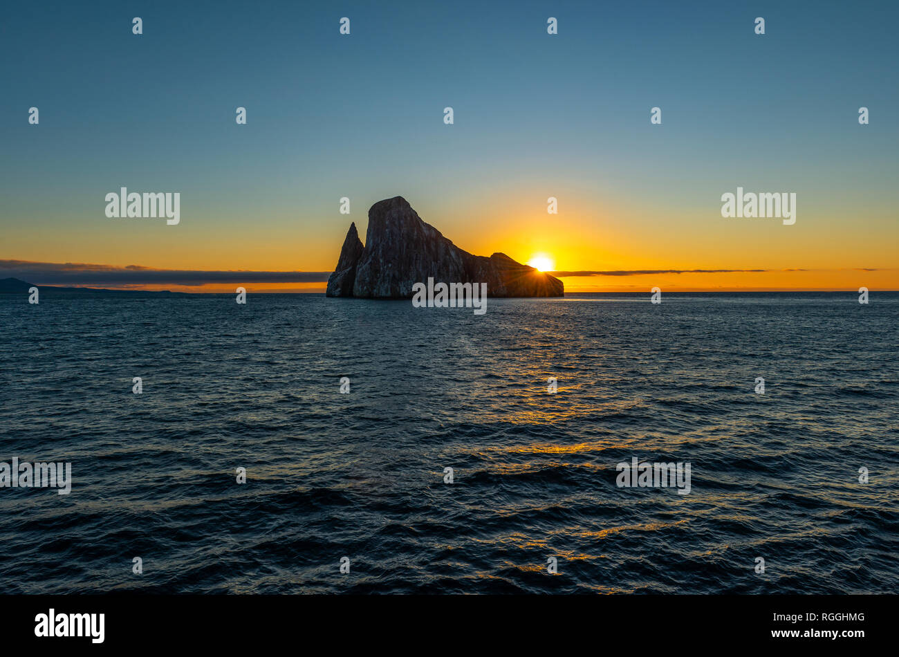 Landscape of the Kicker Rock stone formation at sunset, Galapagos Islands National Park, Ecuador. Stock Photo