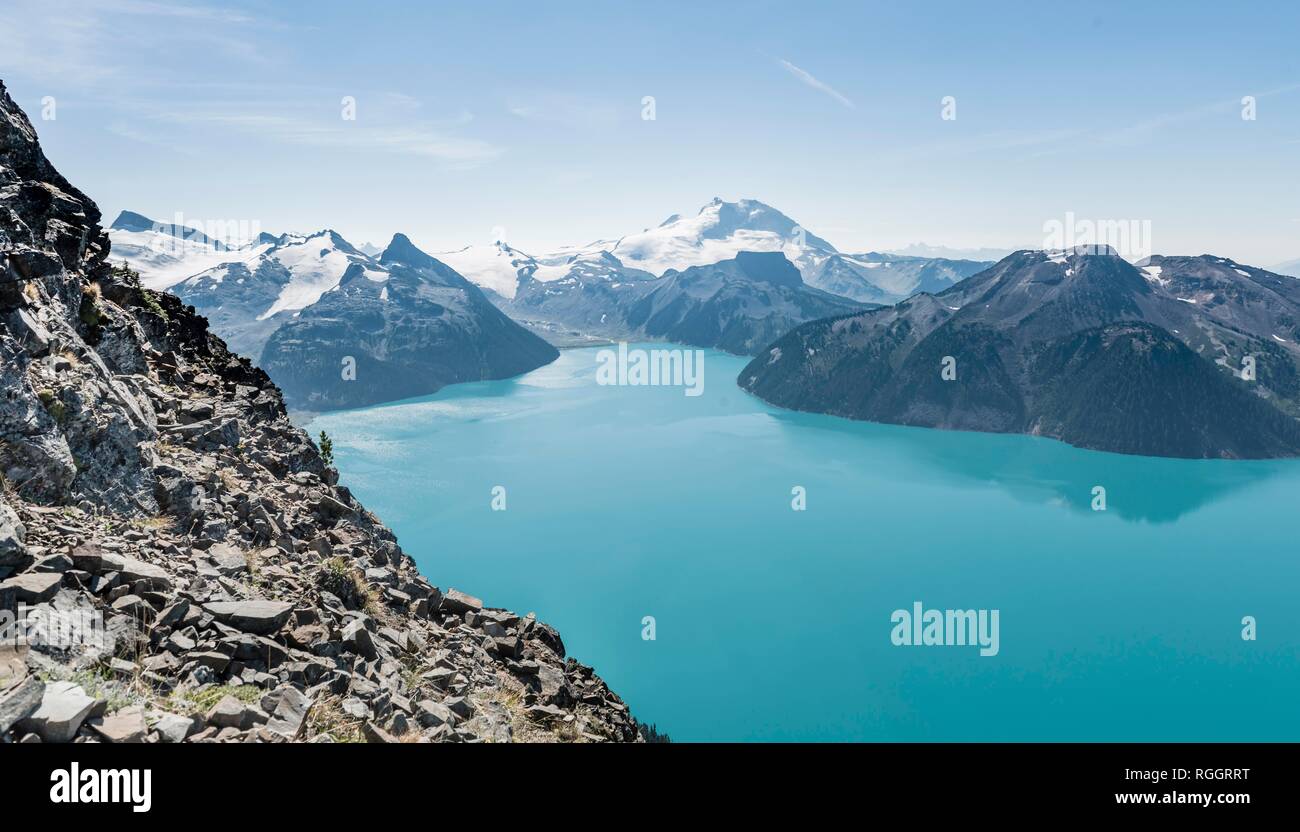 Turquoise Glacial Lake Garibaldi Lake in front of mountain range with