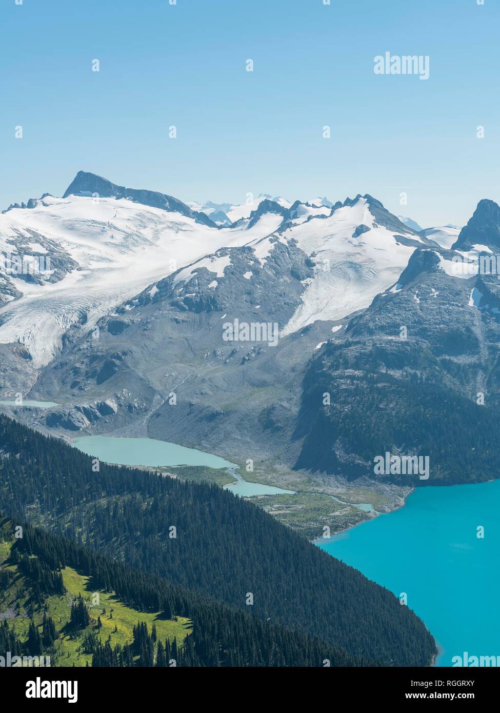 Turquoise Glacial Lake Garibaldi Lake in front of mountain range with