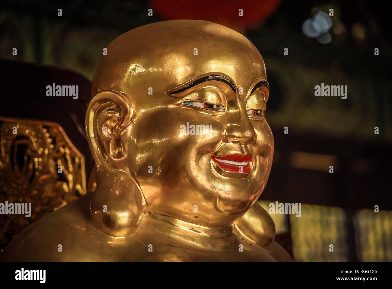 Head of a Buddha sculpture, Happy Buddha, Budai, Chinese temple, Lumbini, Nepal Stock Photo