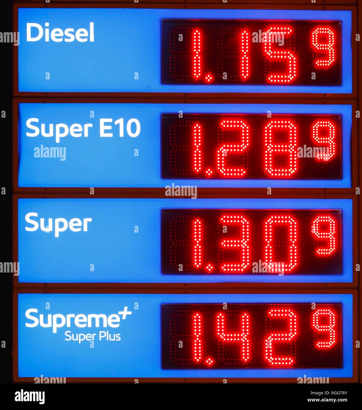 Illuminated Blue Electronic Price Board at a Petrol Station, Germany