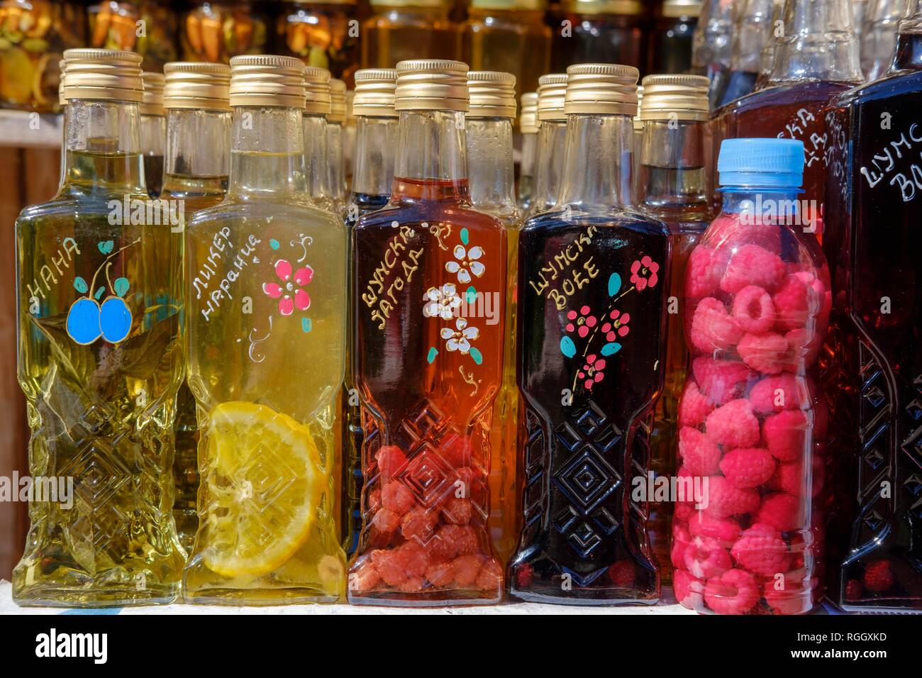 Sales stand with various fruit brandies, Durmitor National Park, near Zabljak, Montenegro Stock Photo