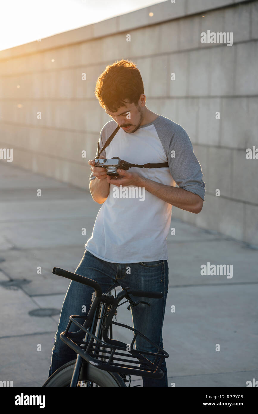 Young man with commuter fixie bike looking at camera Stock Photo