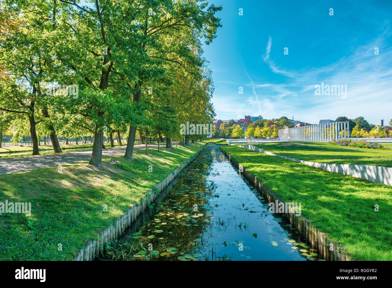 Germany, Mecklenburg-Western Pomerania, Schwerin, Park and 'Schwimmende Wiese' with canal Stock Photo