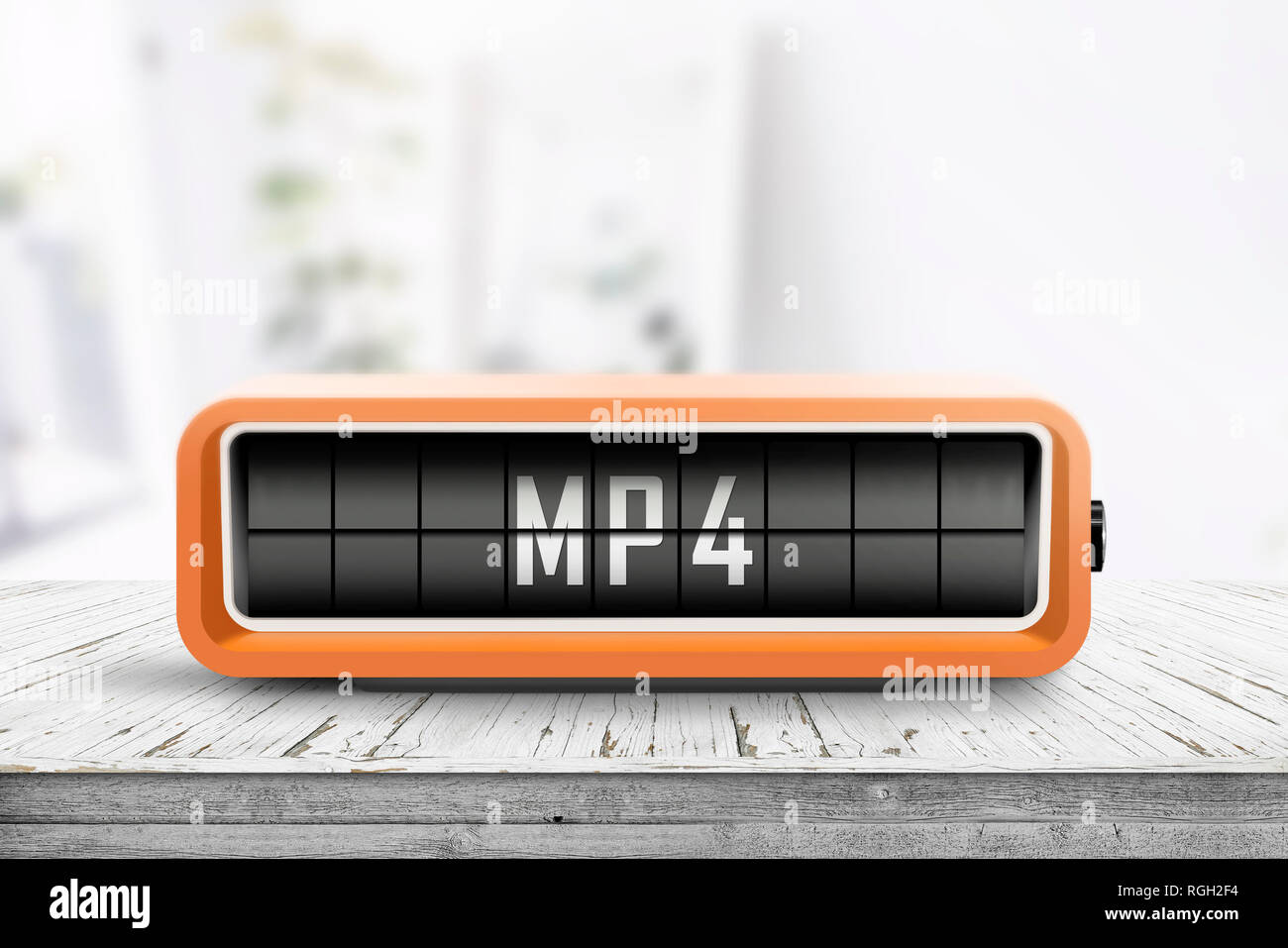 Mp4 sign on a analog device in a bright living room on a wooden desk Stock Photo