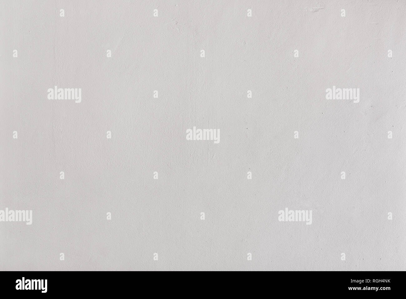 wall with rough texture painted white. Horizontal composition. Stock Photo